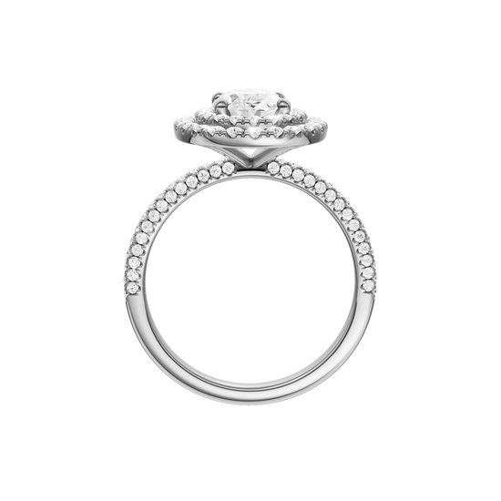 A profile view of the Oval cut diamond engagement ring in platinum with a pavé diamond band and solitaire setting