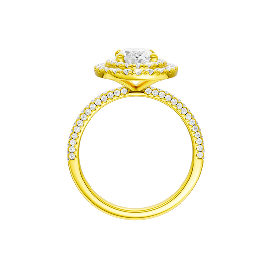 A profile view of the Oval cut diamond engagement ring in 14k yellow gold with a pavé diamond band and solitaire setting