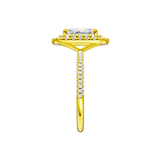 A side view of the Radiant cut diamond engagement ring in 14k yellow gold with a pavé diamond band and solitaire setting