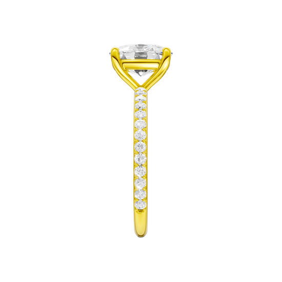 A side view of the Elongated cushion cut diamond engagement ring in 14k yellow gold with a prong diamond band and cathedral setting
