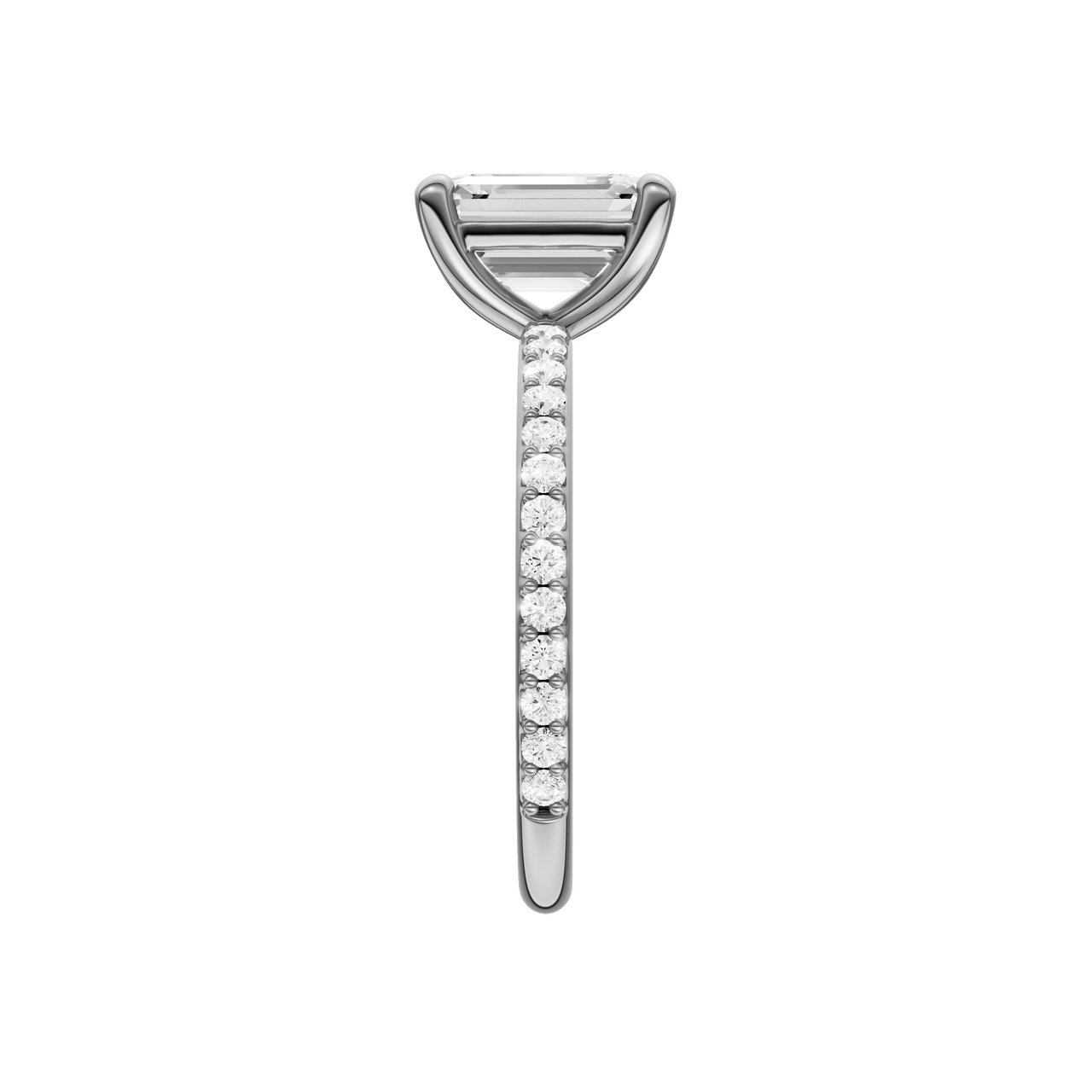A side view of the Emerald cut diamond engagement ring in 14k white gold with a prong diamond band and cathedral setting