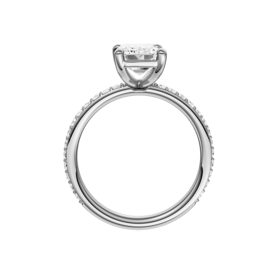 A profile view of the Emerald cut diamond engagement ring in platinum with a prong diamond band and cathedral setting