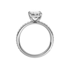 A profile view of the Emerald cut diamond engagement ring in platinum with a prong diamond band and cathedral setting