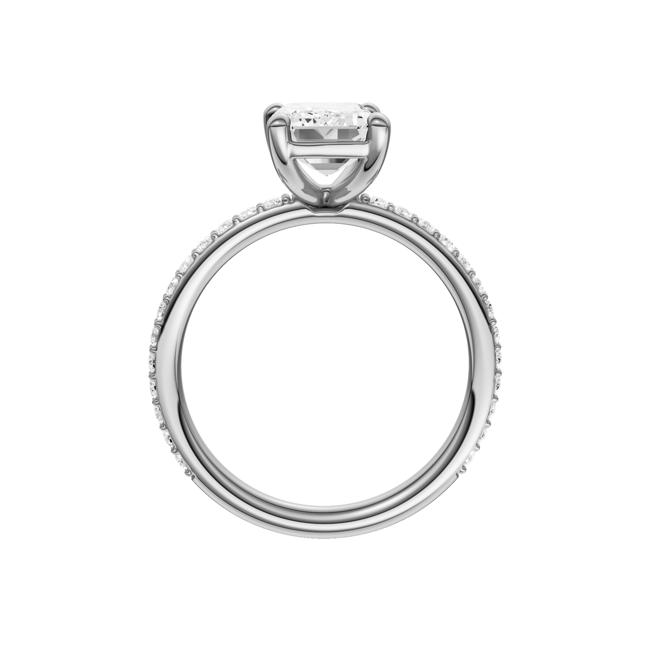 A profile view of the Emerald cut diamond engagement ring in 14k white gold with a prong diamond band and cathedral setting