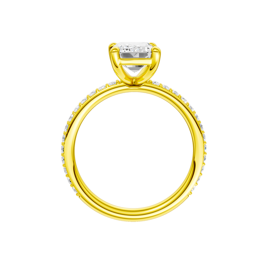 A profile view of the Emerald cut diamond engagement ring in 14k yellow gold with a prong diamond band and cathedral setting