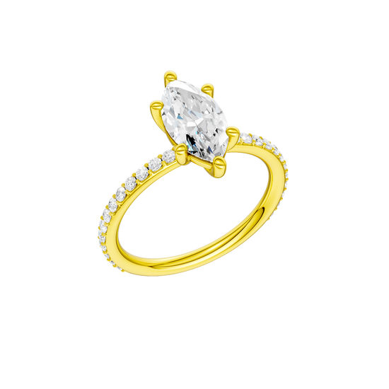A three-quarter view of the Marquise cut diamond engagement ring in 14k yellow gold with a prong diamond band and cathedral setting