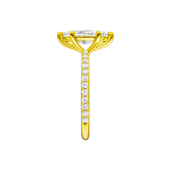 A side view of the Marquise cut diamond engagement ring in 14k yellow gold with a prong diamond band and cathedral setting