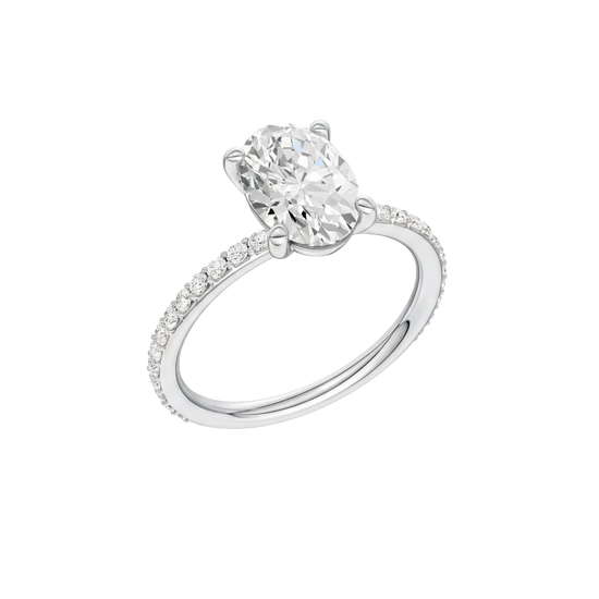A three-quarter view of the Oval cut diamond engagement ring in 14k white gold with a prong diamond band and cathedral setting