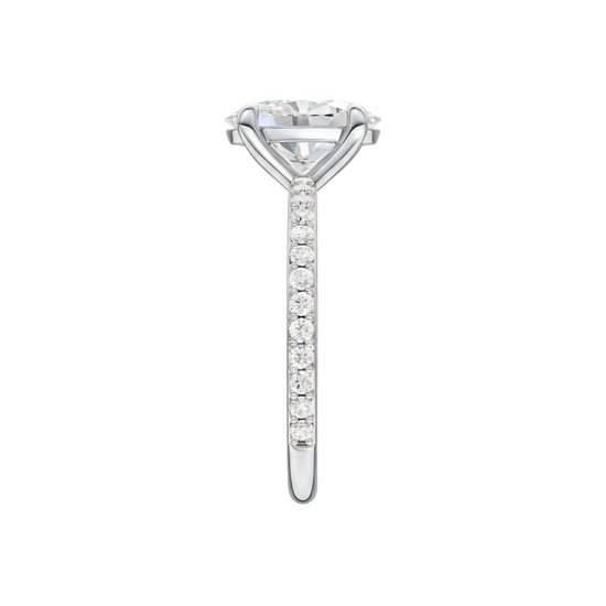 A side view of the Oval cut diamond engagement ring in platinum with a prong diamond band and cathedral setting