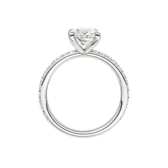 A profile view of the Oval cut diamond engagement ring in platinum with a prong diamond band and cathedral setting