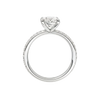 A profile view of the Oval cut diamond engagement ring in platinum with a prong diamond band and cathedral setting