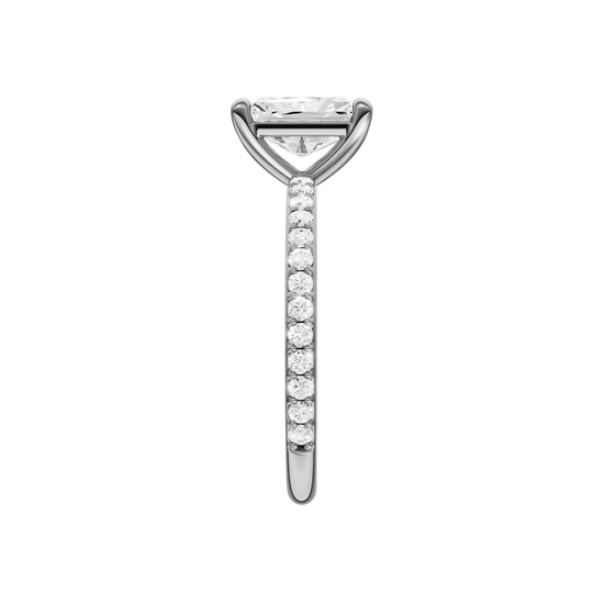A side view of the radiant cut diamond engagement ring in 14k white gold with a prong diamond band and cathedral setting