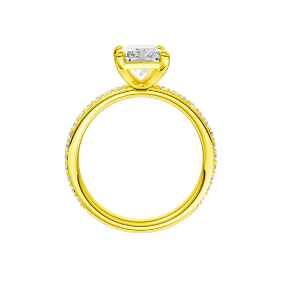 A profile view of the radiant cut diamond engagement ring in 14k yellow gold with a prong diamond band and cathedral setting