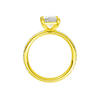 A profile view of the radiant cut diamond engagement ring in 14k yellow gold with a prong diamond band and cathedral setting