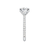 A side view of the Round cut diamond engagement ring in 14k white gold with a prong diamond band and cathedral setting