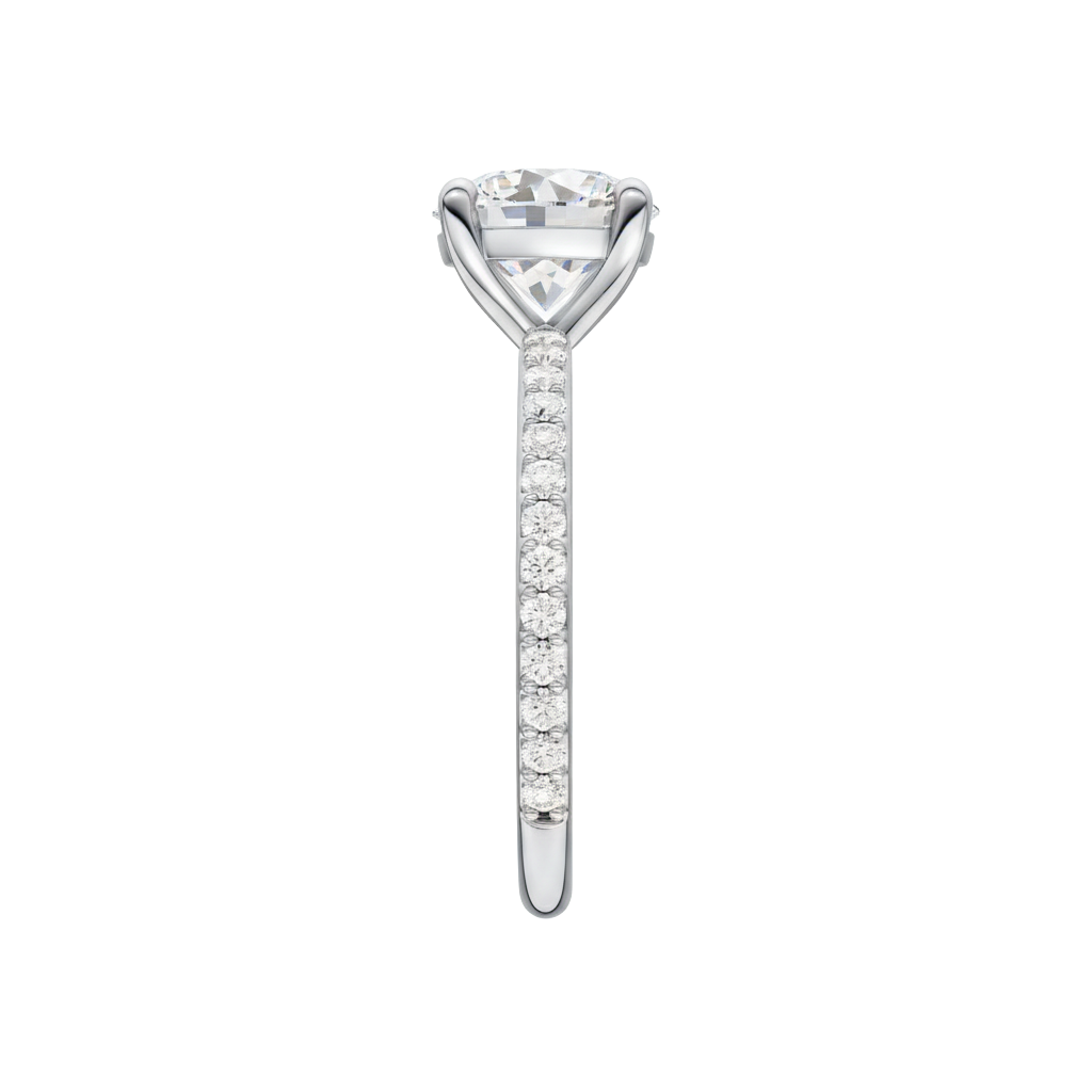 A side view of the Round cut diamond engagement ring in 14k white gold with a prong diamond band and cathedral setting