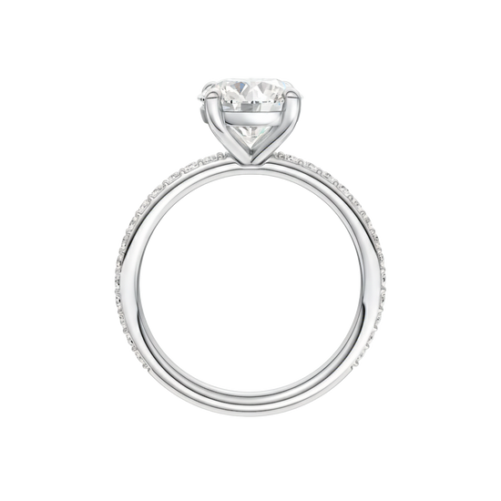 A profile view of the Round cut diamond engagement ring in platinum with a prong diamond band and cathedral setting