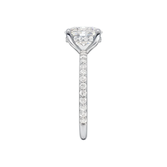 A side view of the Elongated cushion cut diamond engagement ring in platinum with a prong diamond band and cathedral setting