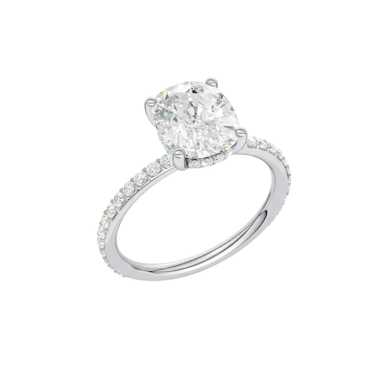 A three-quarter view of the Elongated cushion cut diamond engagement ring in platinum with a prong diamond band and cathedral setting