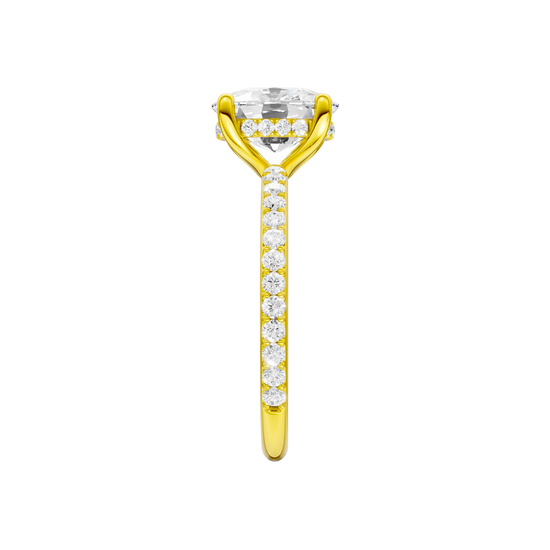 A side view of the Elongated cushion cut diamond engagement ring in 14k yellow gold with a prong diamond band and cathedral setting