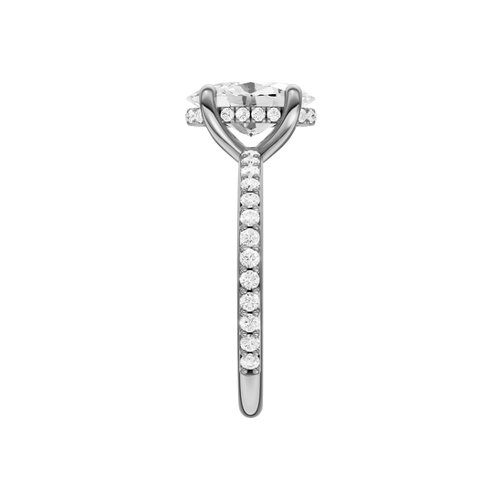 A side view of the Oval cut diamond engagement ring in 14k white gold with a prong diamond band and cathedral setting
