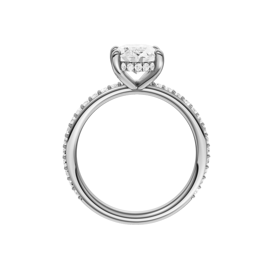 A profile view of the Oval cut diamond engagement ring in 14k white gold with a prong diamond band and cathedral setting