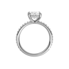 A profile view of the Oval cut diamond engagement ring in platinum  with a prong diamond band and cathedral setting
