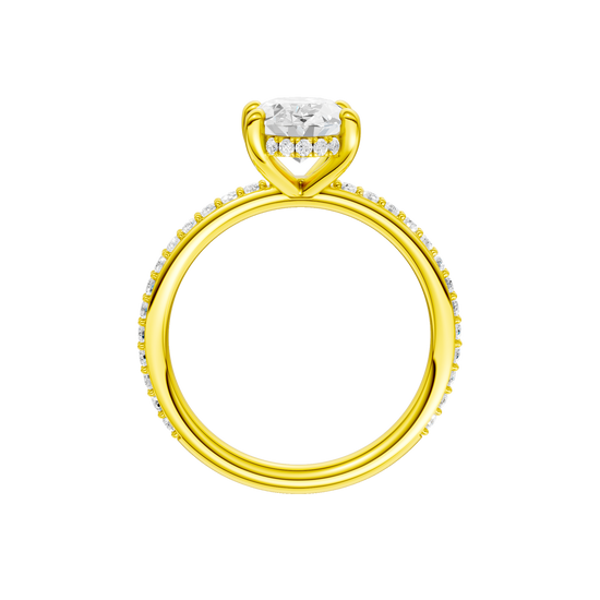 A profile view of the Oval cut diamond engagement ring in 14k yellow gold with a prong diamond band and cathedral setting