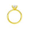 A profile view of the Pear cut diamond engagement ring in 14k yellow gold with a prong diamond band and cathedral setting