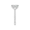 A side view of the Radiant cut diamond engagement ring in 14k white gold with a diamond band and hidden halo, cathedral setting