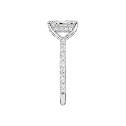 A side view of the Radiant cut diamond engagement ring in 14k white gold with a diamond band and hidden halo, cathedral setting