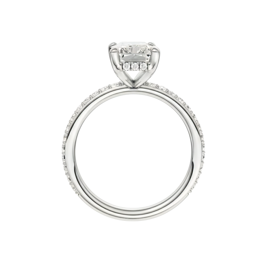 A profile view of the Radiant cut diamond engagement ring in platinum with a diamond band and hidden halo, cathedral setting