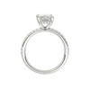 A profile view of the Radiant cut diamond engagement ring in platinum with a diamond band and hidden halo, cathedral setting