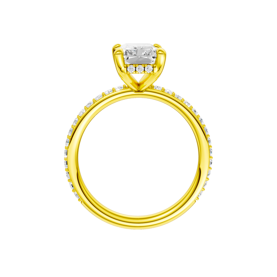 A profile view of the Radiant cut diamond engagement ring in 14k yellow gold with a diamond band and hidden halo, cathedral setting