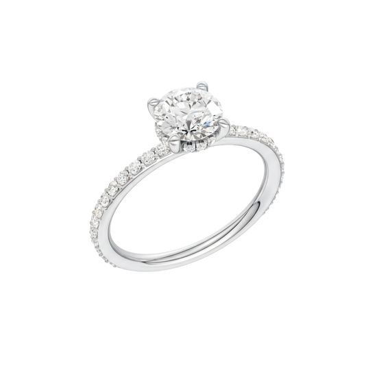 A three-quarter view of the Round cut diamond engagement ring in 14k white gold with a prong diamond band and cathedral setting