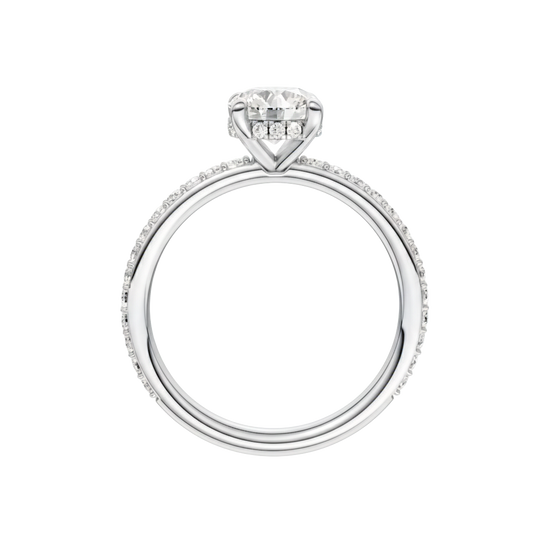 A profile view of the Round cut diamond engagement ring in platinum with a prong diamond band and cathedral setting