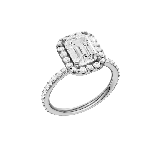 A three-quarter view of the Emerald cut diamond engagement ring in 14k white gold with a prong diamond band and cathedral setting