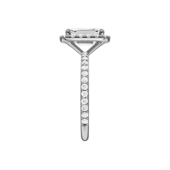 A side view of the Emerald cut diamond engagement ring in 14k white gold with a prong diamond band and cathedral setting