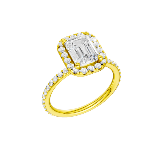 A three-quarter view of the Emerald cut diamond engagement ring in 14k yellow gold with a prong diamond band and cathedral setting