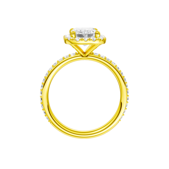 A profile view of the Emerald cut diamond engagement ring in 14k yellow gold with a prong diamond band and cathedral setting