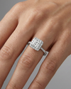 Princess cut diamond engagement ring in 14k white gold with a prong diamond band and cathedral setting on a hand
