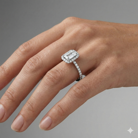 Radiant cut diamond engagement ring in 14k white gold with a prong diamond band and cathedral setting on a hand