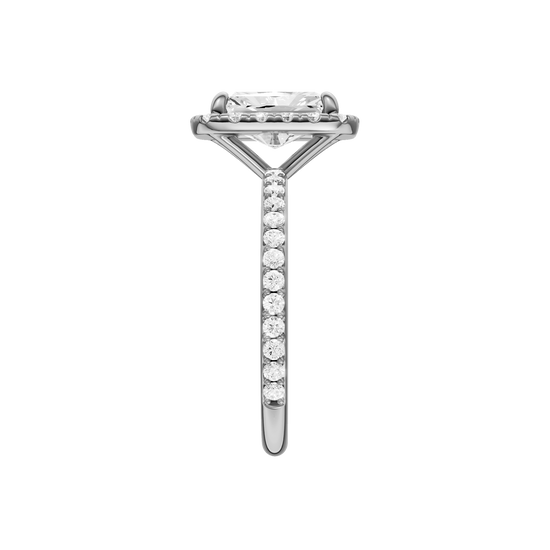 A side view of the radiant cut diamond engagement ring in 14k white gold with a prong diamond band and cathedral setting