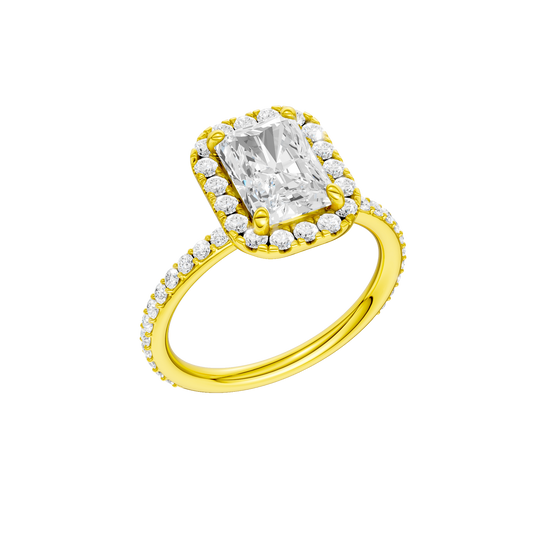 A three-quarter view of the radiant cut diamond engagement ring in 14k yellow gold with a prong diamond band and cathedral setting