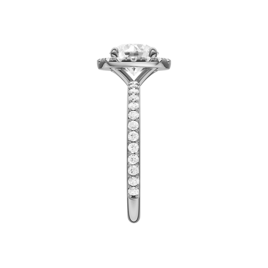 A side view of the Round cut diamond engagement ring in 14k white gold with a prong diamond band and cathedral setting