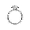 A profile view of the Round cut diamond engagement ring in 14k white gold with a prong diamond band and cathedral setting