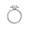 A profile view of the Round cut diamond engagement ring in platinum with a prong diamond band and cathedral setting