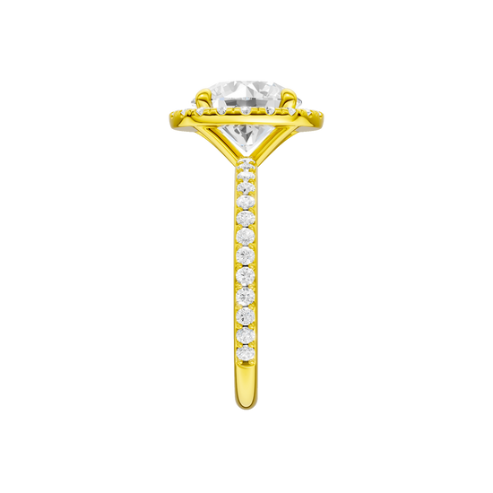 A side view of the Round cut diamond engagement ring in 14k yellow gold with a prong diamond band and cathedral setting