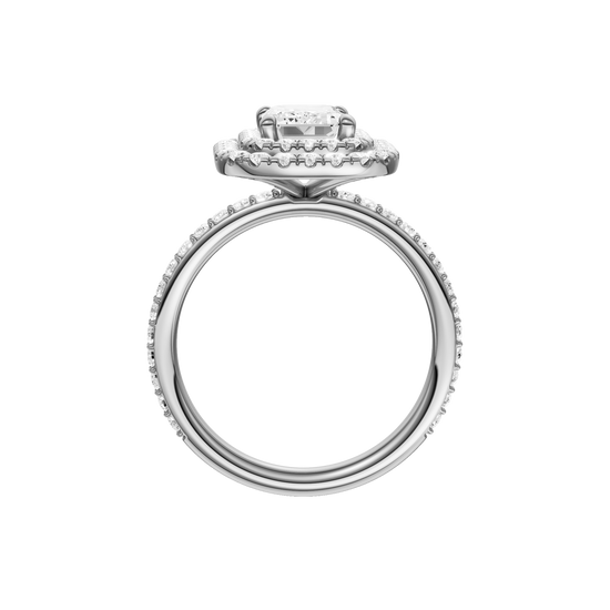 A profile view of the Emerald cut diamond engagement ring in 14k white gold with a prong diamond band and cathedral setting