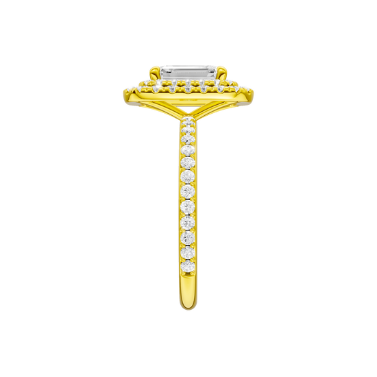 A side view of the Emerald cut diamond engagement ring in 14k yellow gold with a prong diamond band and cathedral setting